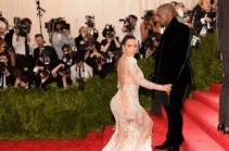 Kim Kardashian wears her most daring dress yet to the Met Gala as she flashes flesh in a sheer Roberto Cavalli gown