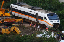 Taiwan rescuers start clearing debris at deadly rail disaster site