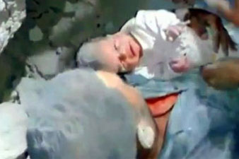 Baby rescued from rubble in Aleppo
