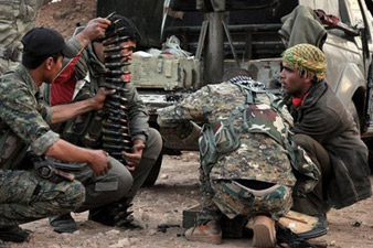 Kurds seize Islamic State arms near besieged town – monitor