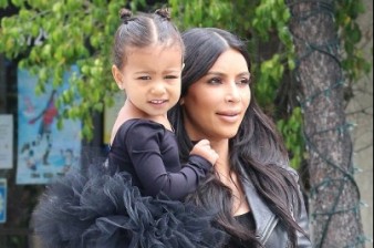 'My little butterfly!': Kim Kardashian adds hair accessories to daughter North's updo after trip to dance studio
