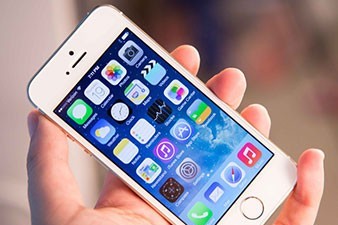 Apple posts record third-quarter as iPhone sales surge