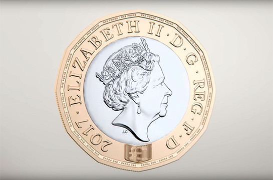 В Великобритании поступает в обращение новая монета номиналом в один фунт (Видео)