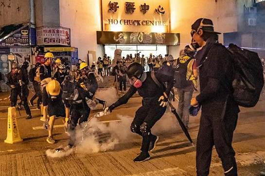 Hong Kong protests: Clashes as police fire tear gas into rail station