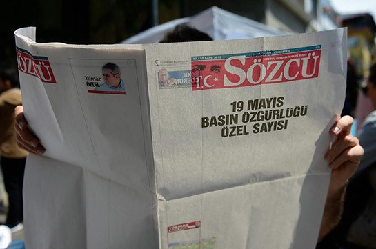 Turkish court sentences to jail seven at opposition newspaper