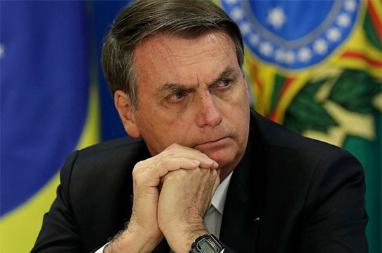 Brazilian President Jair Bolsonaro says he tested negative for coronavirus following reports that he'd tested positive