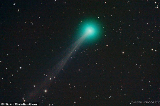 Green-tinged Comet Swan with an 11 million-mile-long tail flies past Earth on its way to the Sun
